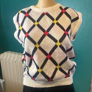 Cute little sweater vest size medium